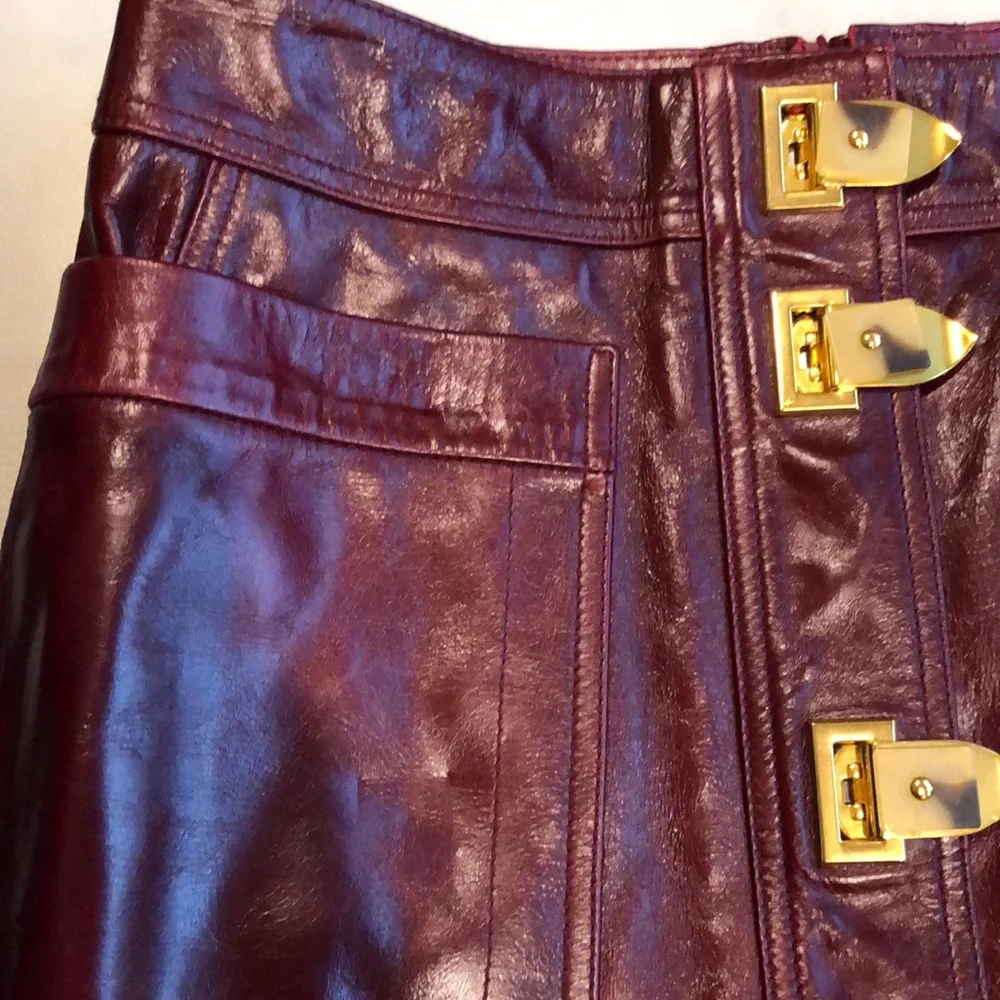 Tory Burch burgundy leather skirt with gold clasps on front - Picture 3 of 8